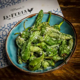 Padron peppers flash fried in olive oil and finished with sea salt.

A simple Spanish classic, best shared around the table alongside a glass of something cold. 

#laferia #spanishtapas #harrogaterestaurants